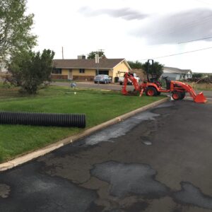 Modern digging machinery installing drainage