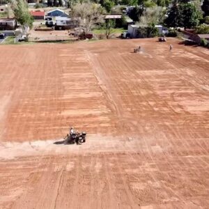 Reclamation work preparing a large field with machinery