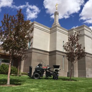 Church with landscaping machinery and green grass